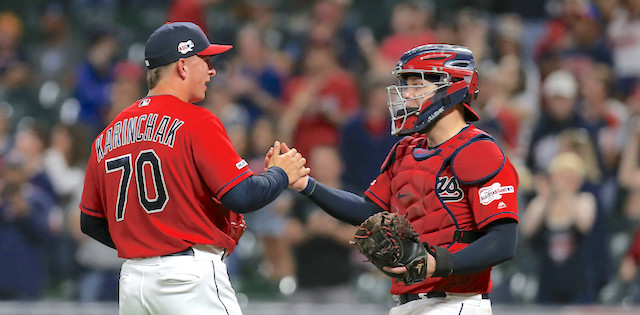 Cleveland Indians relief pitcher James Karinchak air high fives